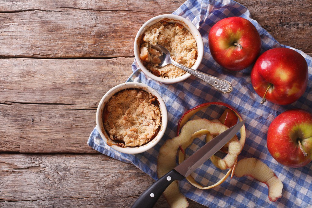 Traditional apple crumble in the pot horizontal top view